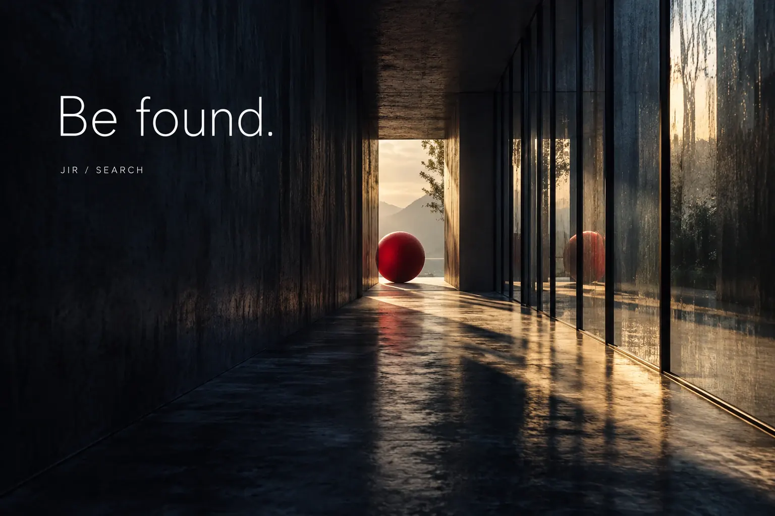 暗い回廊のガラスに光が屈折し、奥に赤い球体が見つかる写真作品。Be found.の文字。